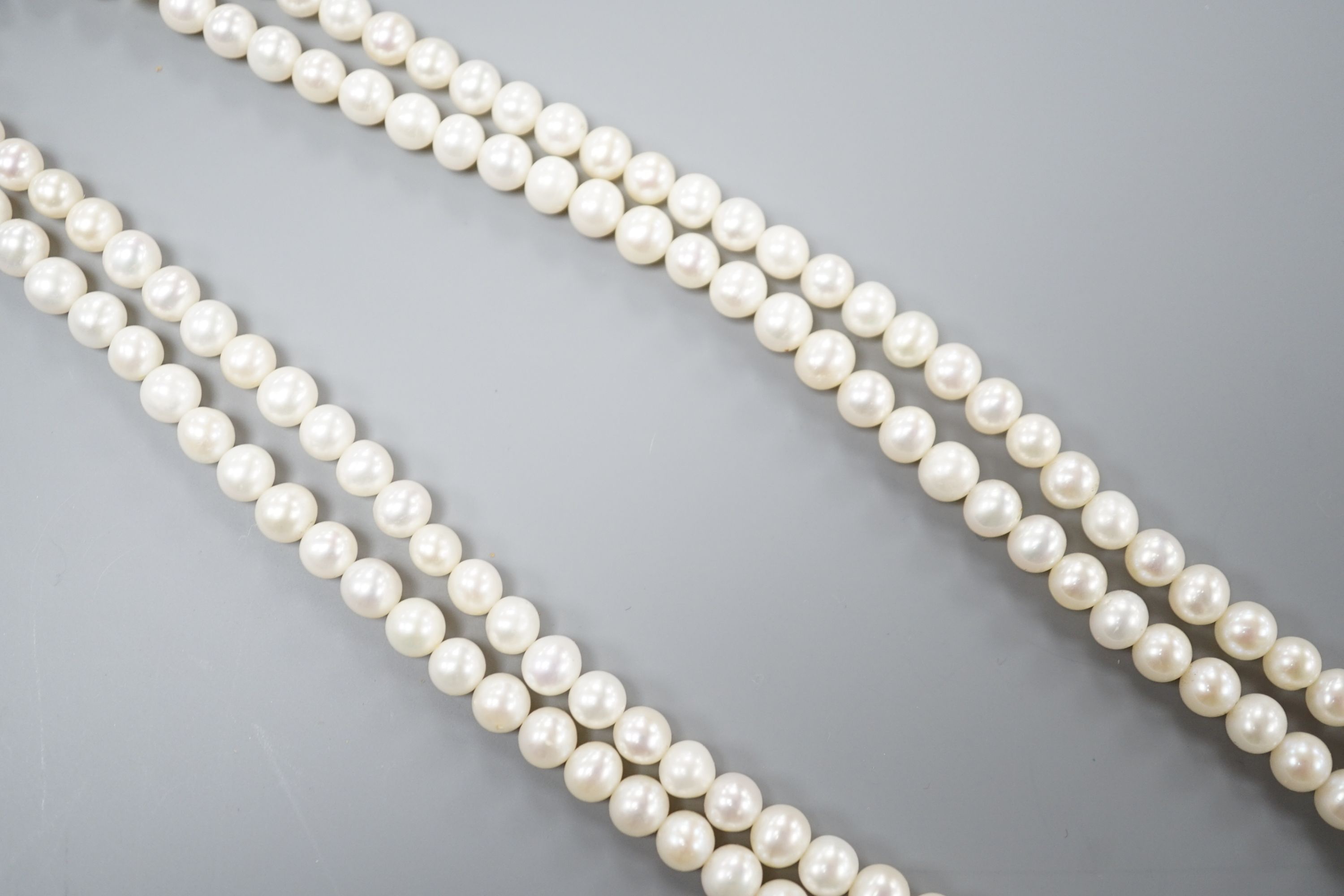 A Portuguese double strand cultured pearl necklace, with diamond set 800 finesse white metal clasp, 23.5cm.